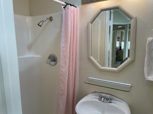 a bathroom with a sink and toilet