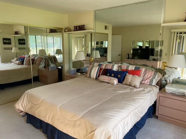 77413 Sawgrass Circle Palm Desert, CA 92211 - Photo 10 of 12 a bedroom with bed and a couch
