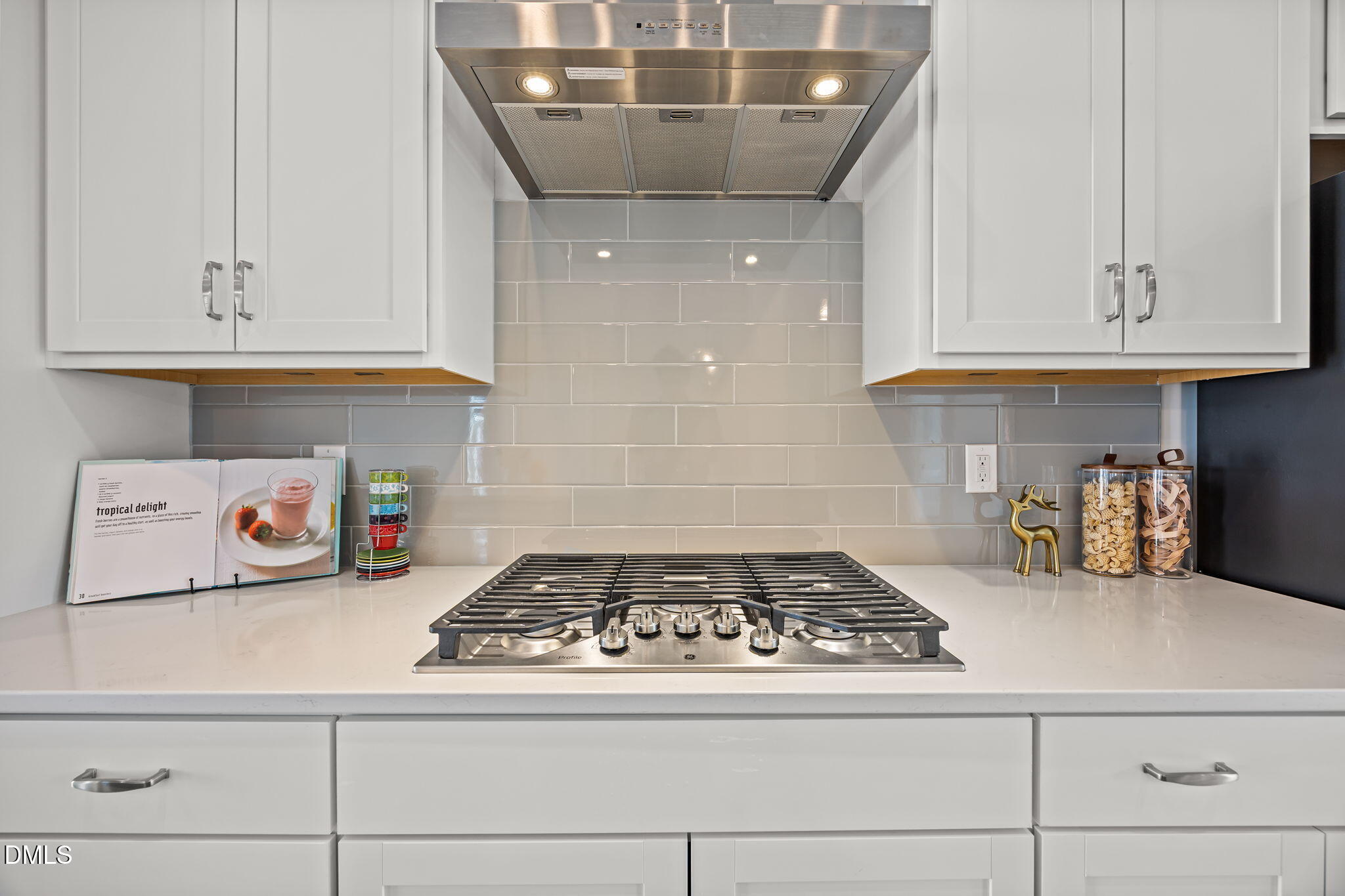 501 Hedrick Ridge Road Cary, NC 27519 - Photo 16 of 47 a kitchen with a stove and cabinets