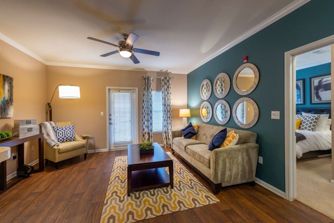 2840 Shadowbriar Drive, Unit B3 Houston, TX 77077 - Photo 12 of 22 a living room with furniture and a clock