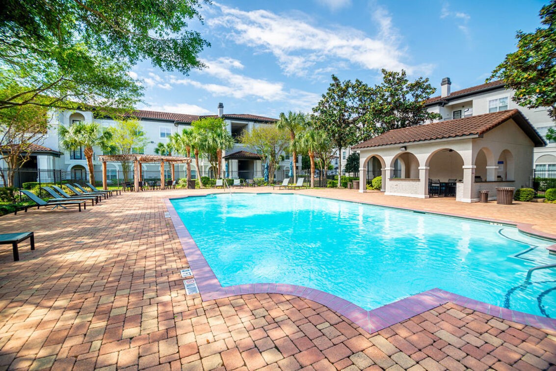 2840 Shadowbriar Drive, Unit B3 Houston, TX 77077 - Photo 13 of 22 a view of a white house with a yard table and chairs