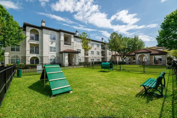 a front view of a house with a yard table and chairs