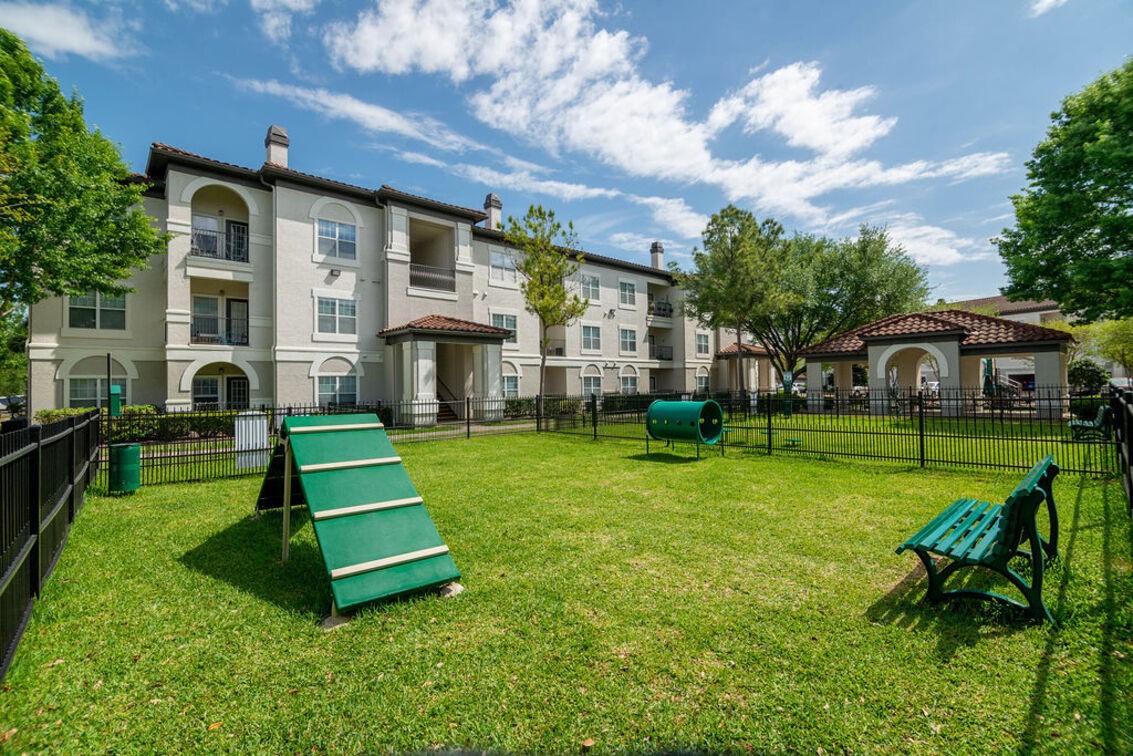 2840 Shadowbriar Drive, Unit B3 Houston, TX 77077 - Photo 17 of 22 a front view of a house with a yard table and chairs