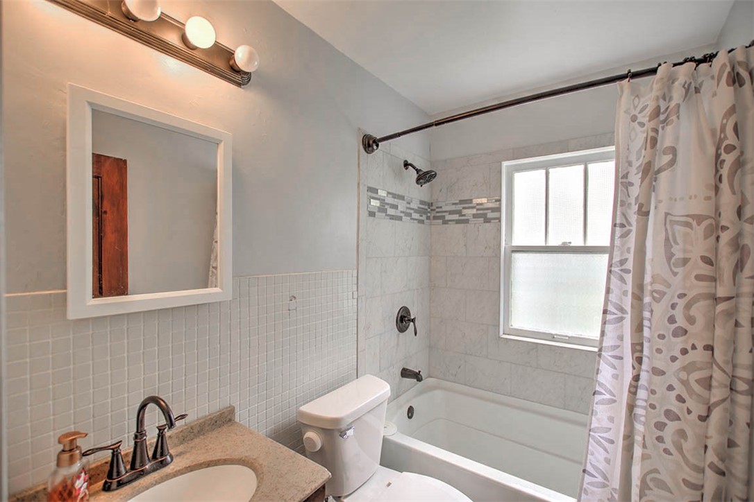 1344 West Sunset Avenue Decatur, IL 62522 - Photo 12 of 17 a bathroom with a sink a toilet and shower