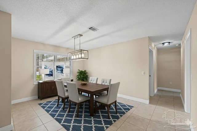 a open kitchen with stainless steel appliances granite countertop a sink and a refrigerator