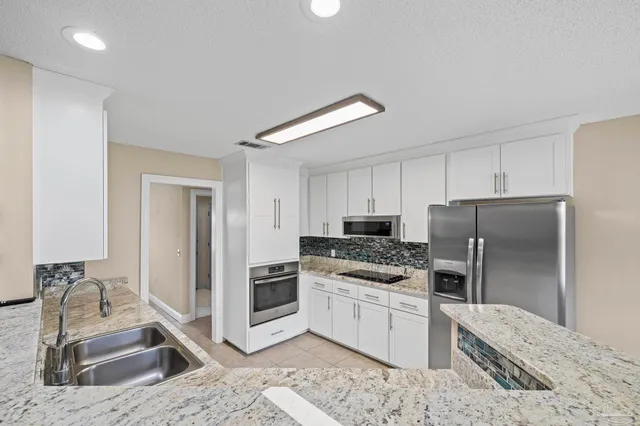 a bathroom with a sink double vanity and a mirror