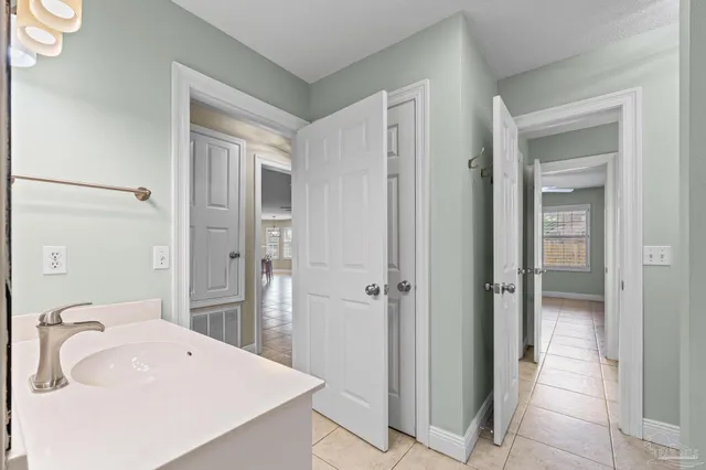 a bathroom with a sink a mirror and a shower