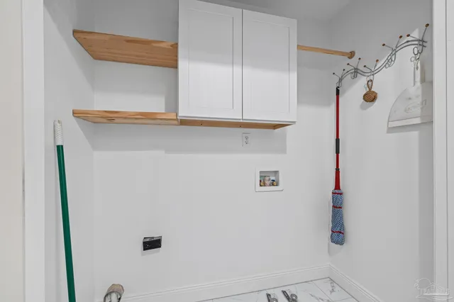 wooden floor in an empty room with a ceiling fan
