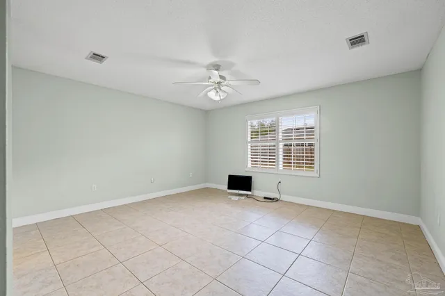 a bathroom with a toilet and shower