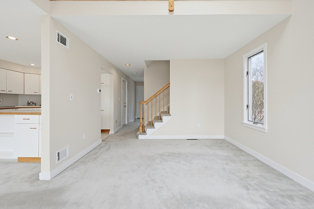 38 Poppasquash Road, Unit 38 North Attleboro, MA 02760 - Photo 14 of 36 a view of an empty room with a window
