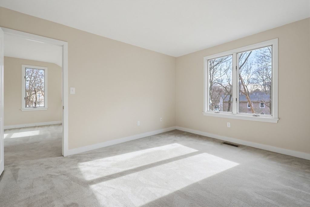38 Poppasquash Road, Unit 38 North Attleboro, MA 02760 - Photo 22 of 36 a view of an empty room with a window