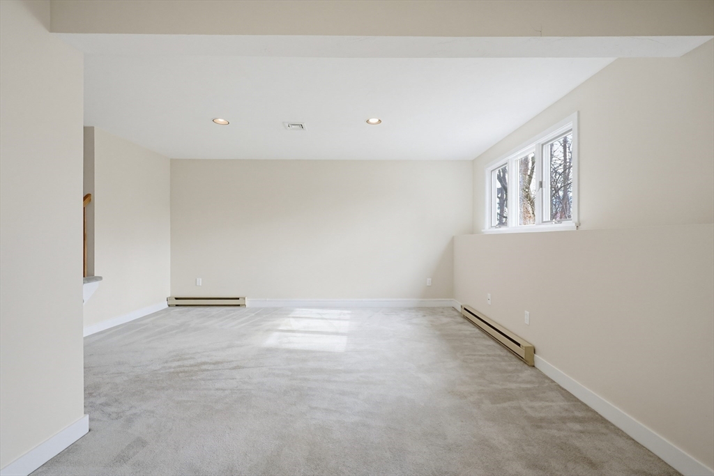 38 Poppasquash Road, Unit 38 North Attleboro, MA 02760 - Photo 28 of 36 an empty room with windows