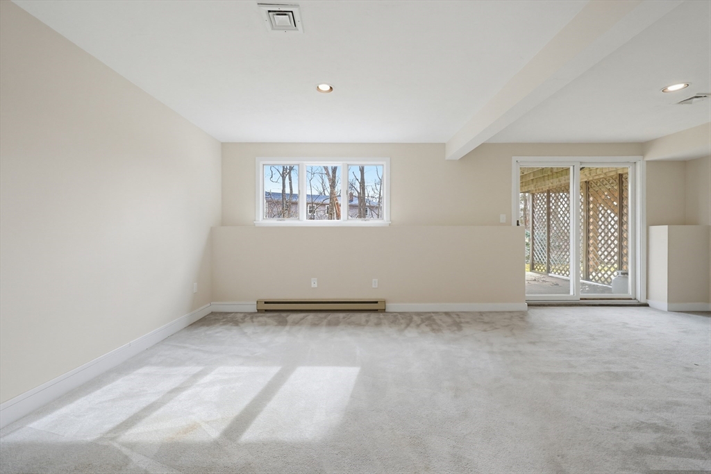 38 Poppasquash Road, Unit 38 North Attleboro, MA 02760 - Photo 29 of 36 an empty room with windows