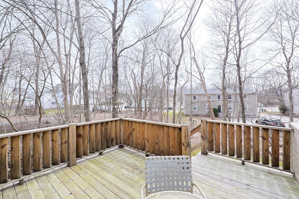38 Poppasquash Road, Unit 38 North Attleboro, MA 02760 - Photo 35 of 36 a view of balcony with wooden floor and fence