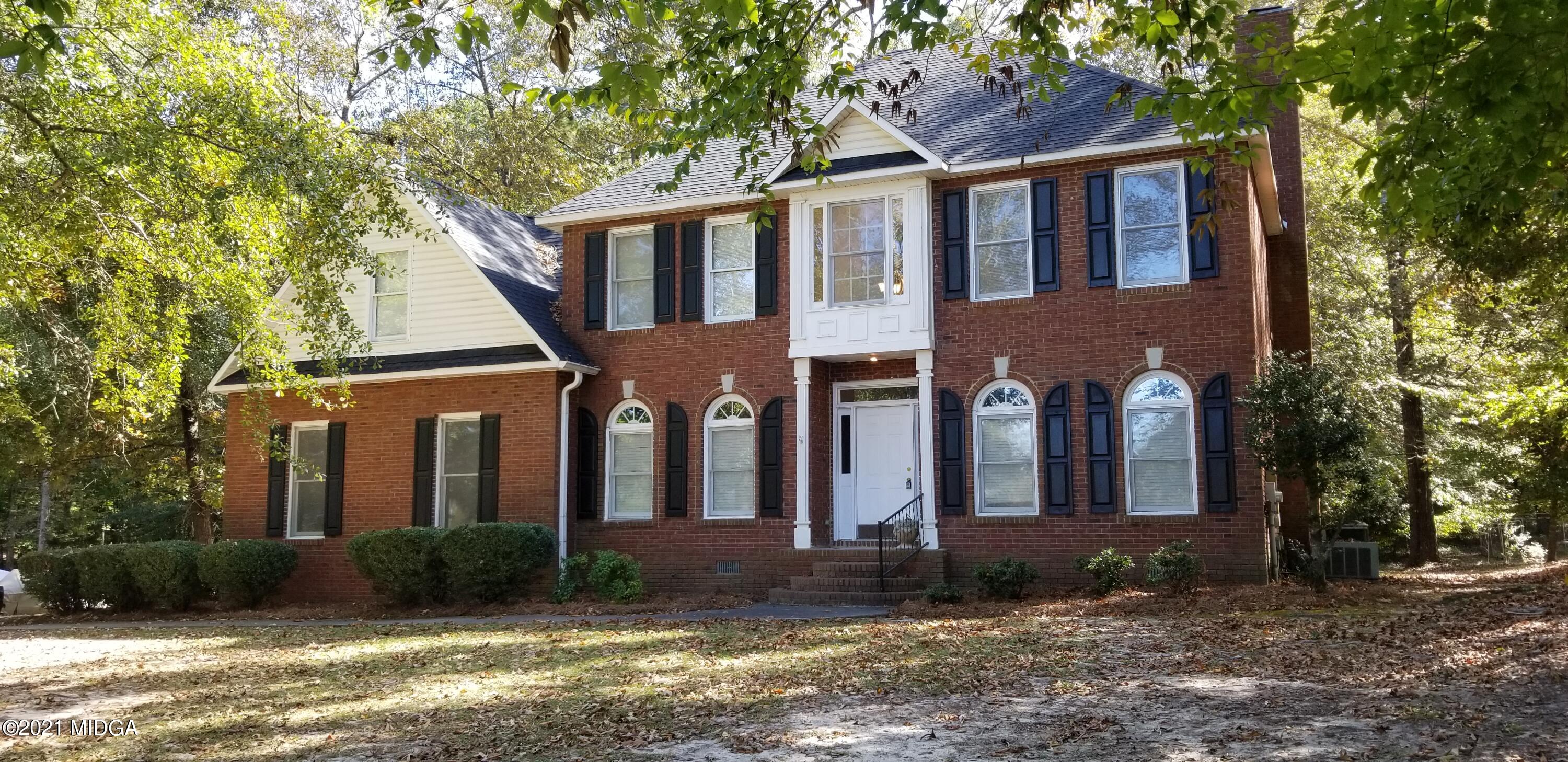 208 Gates Road Lizella, GA 31052 - Photo 1 of 55 a front view of a house with a yard