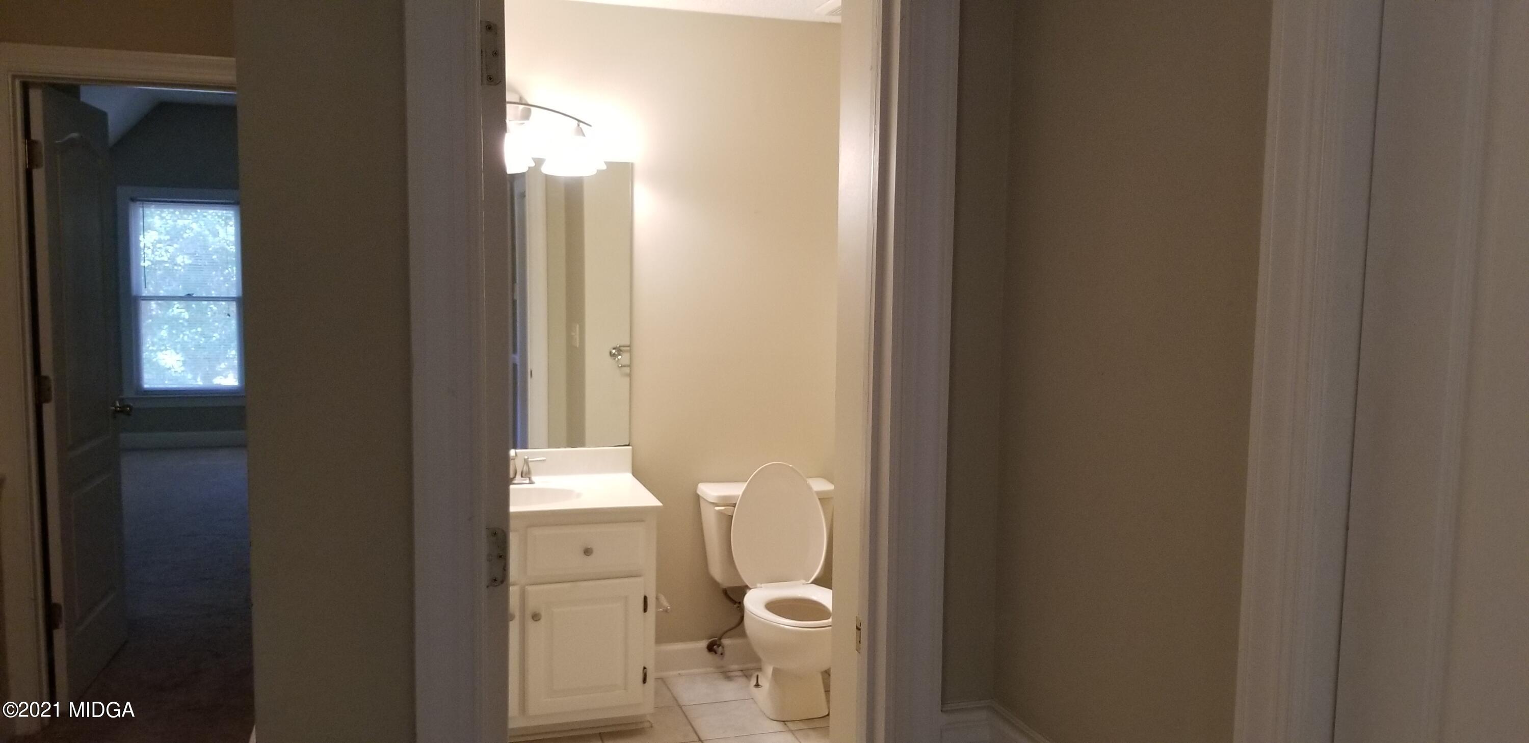 208 Gates Road Lizella, GA 31052 - Photo 38 of 55 a bathroom with a toilet