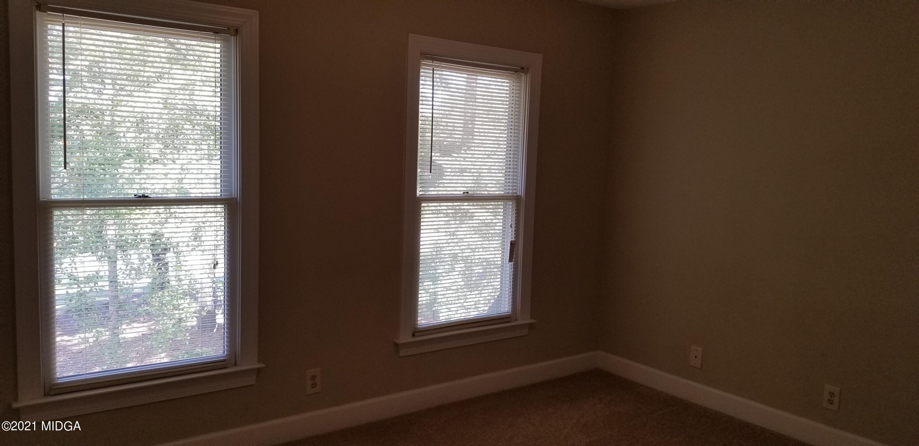 208 Gates Road Lizella, GA 31052 - Photo 40 of 55 a view of an empty room with a window