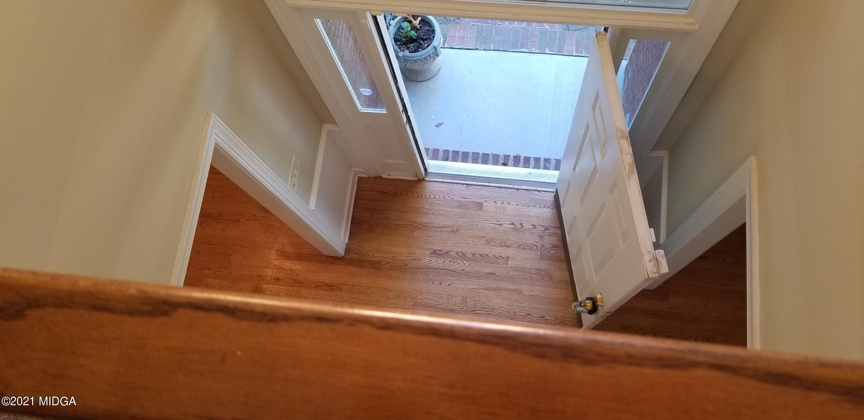 208 Gates Road Lizella, GA 31052 - Photo 4 of 55 a view of staircase with wooden floor and stairs
