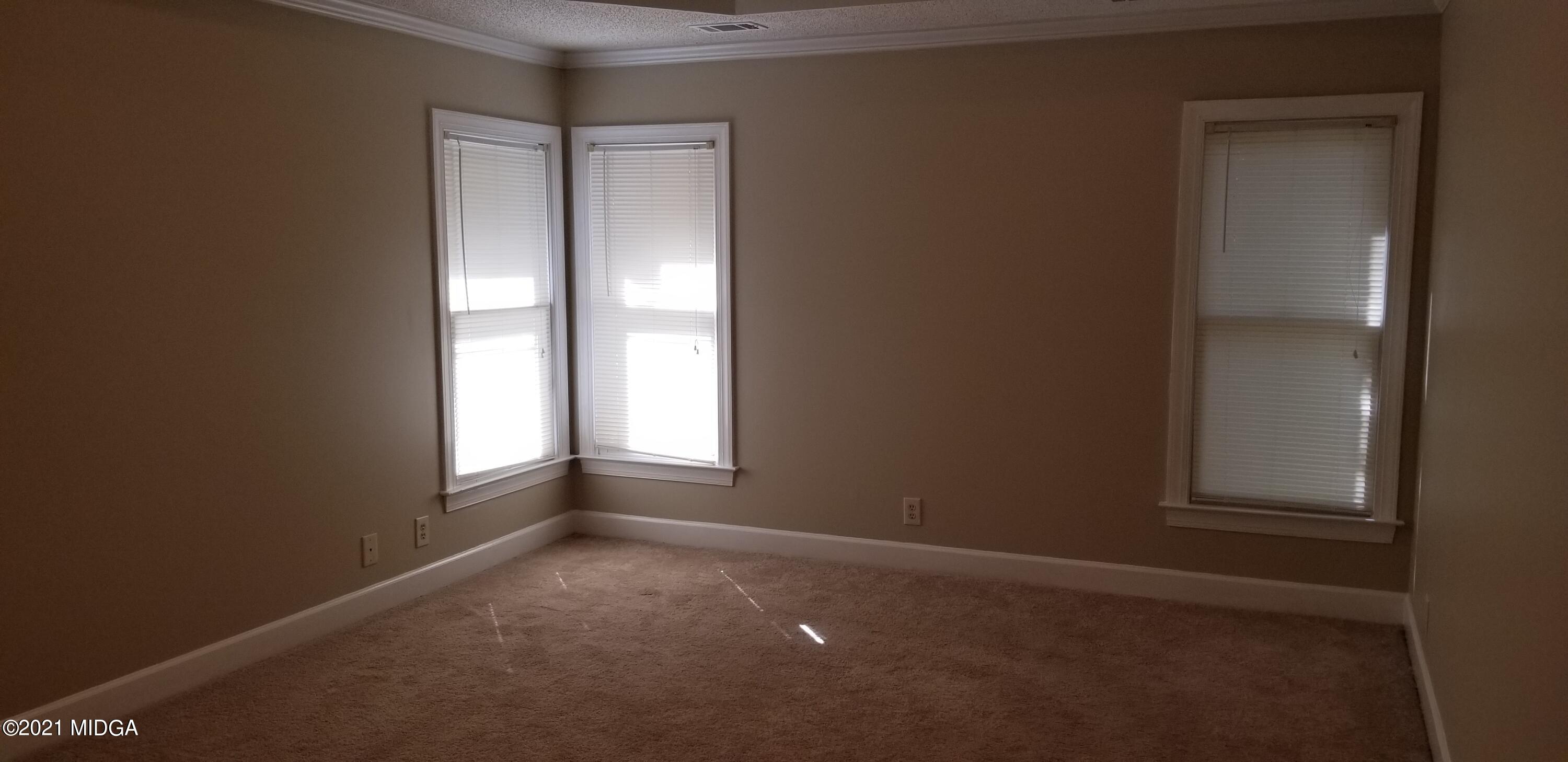 208 Gates Road Lizella, GA 31052 - Photo 43 of 55 an empty room with windows and closet