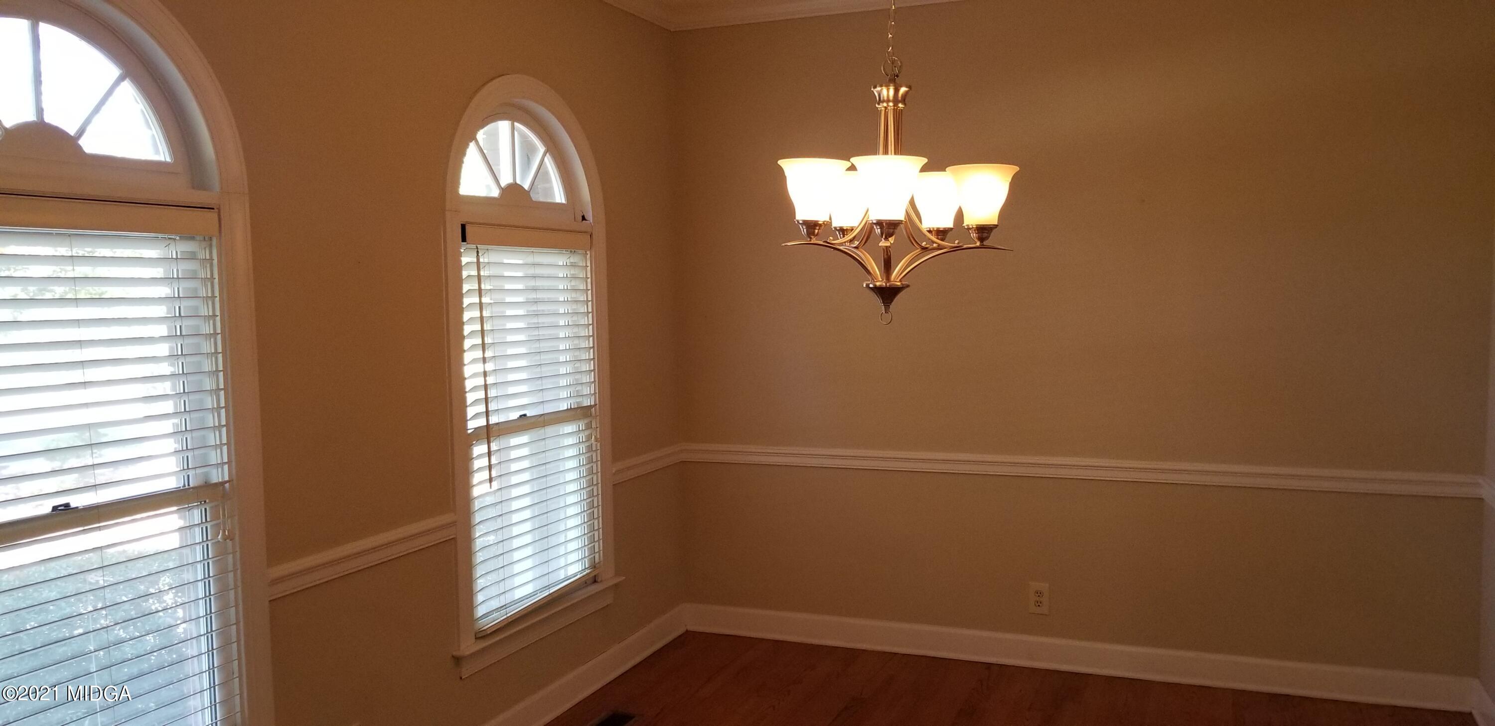 208 Gates Road Lizella, GA 31052 - Photo 5 of 55 a view of a chandelier fan and wooden floor