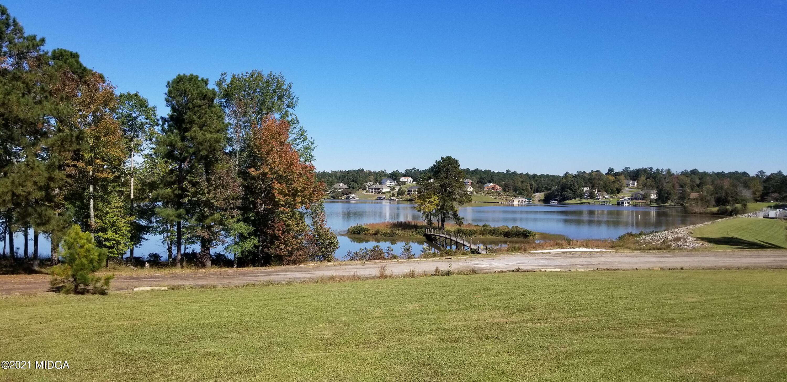 208 Gates Road Lizella, GA 31052 - Photo 51 of 55 a view of a lake with houses