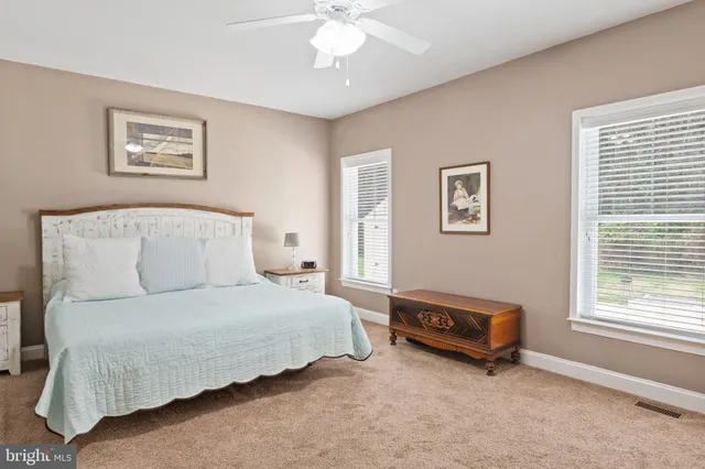 a bedroom with furniture and flat screen tv
