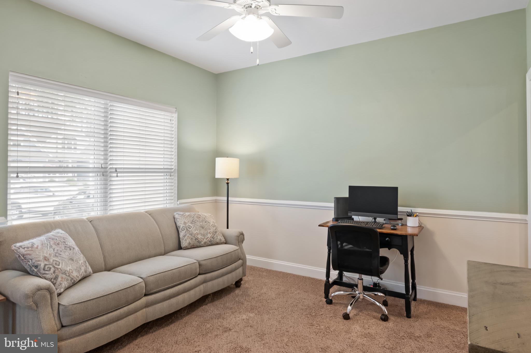 18067 Emerson Way Georgetown, DE 19947 - Photo 21 of 37 a living room with furniture and a window