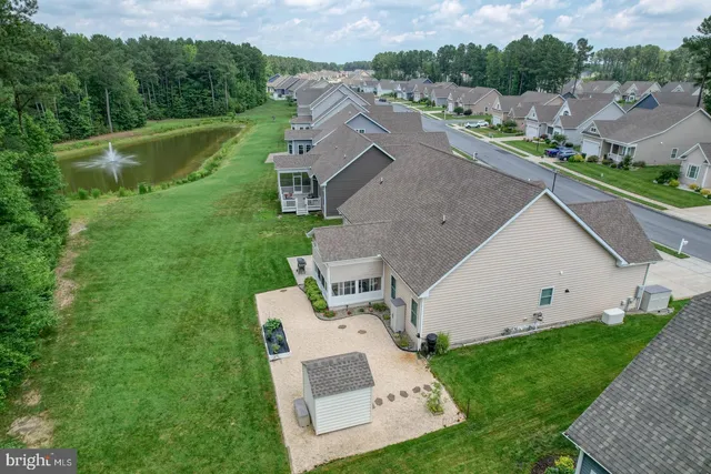 a aerial view of a house with a yard