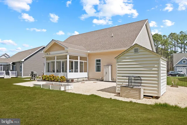 an aerial view of a house with garden space and street view