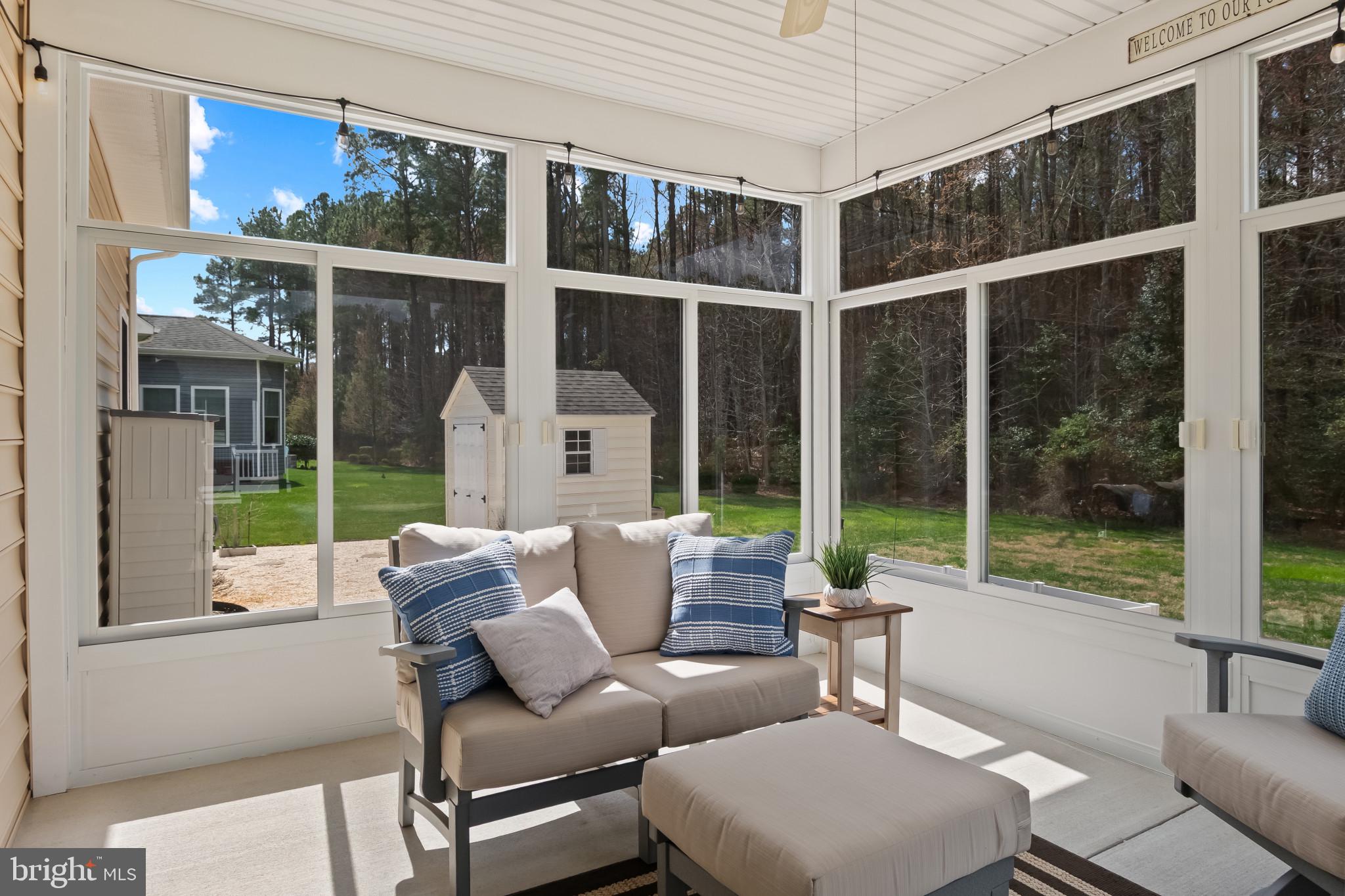 18067 Emerson Way Georgetown, DE 19947 - Photo 5 of 37 a living room with furniture and a large window