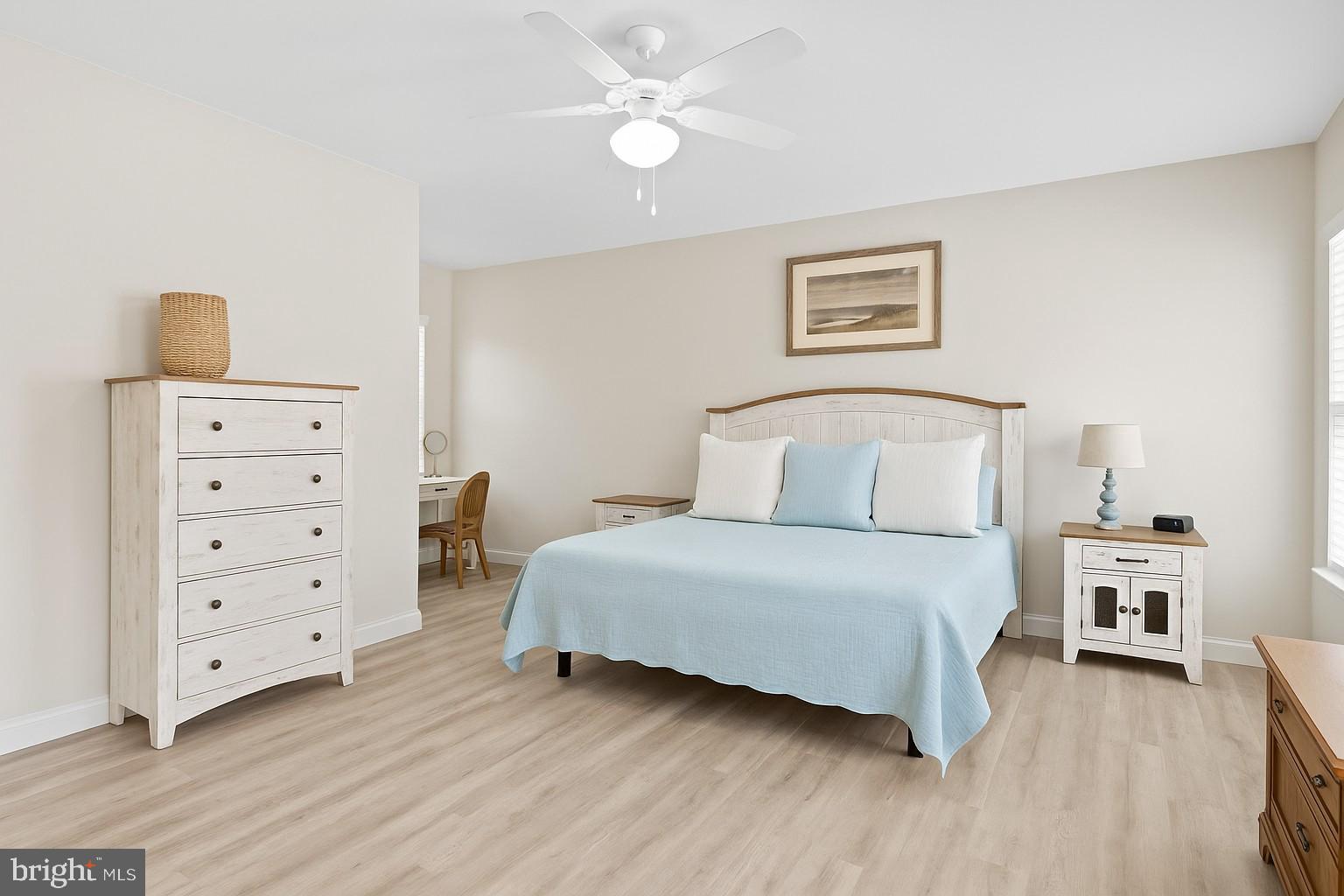 18067 Emerson Way Georgetown, DE 19947 - Photo 8 of 37 a bedroom with a bed and wooden floor