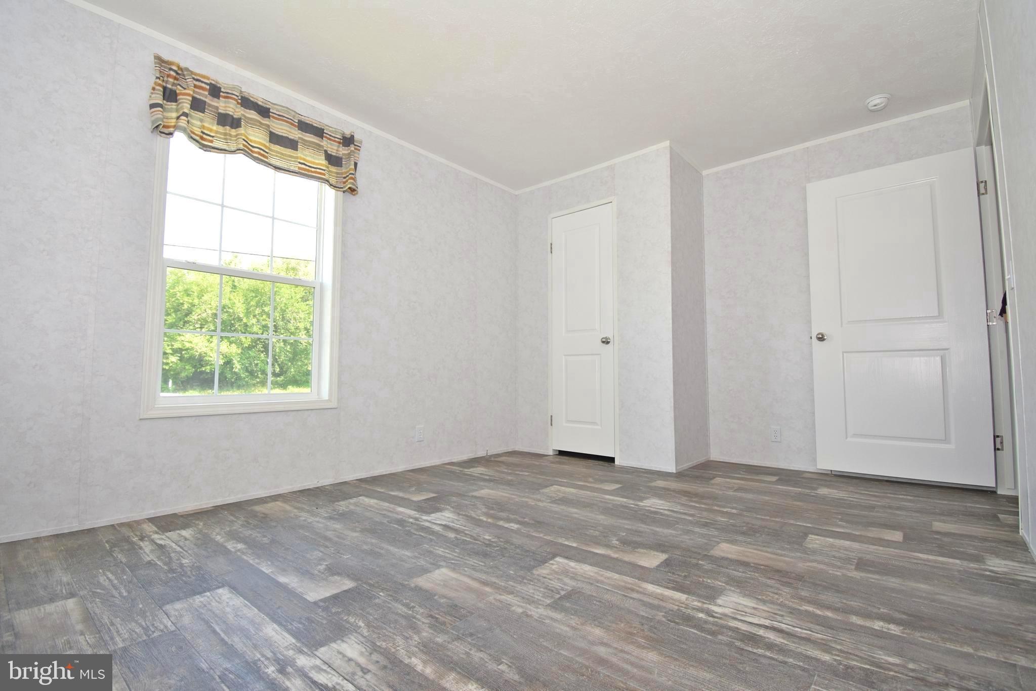 5814 Homestead Street Salisbury, MD 21801 - Photo 8 of 12 a view of an empty room with a window