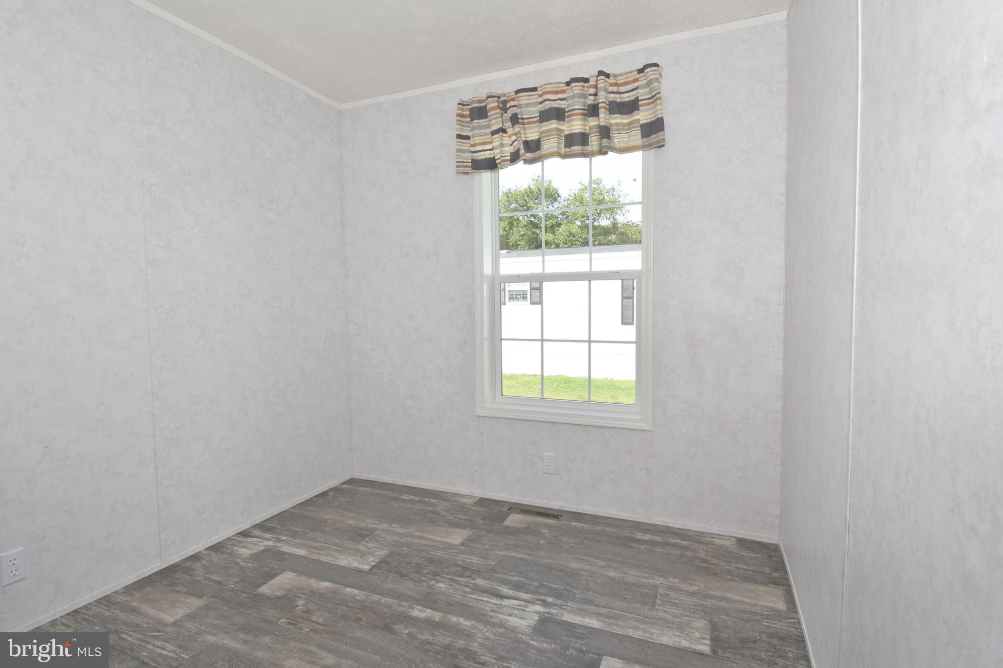 5814 Homestead Street Salisbury, MD 21801 - Photo 10 of 12 an empty room with a window