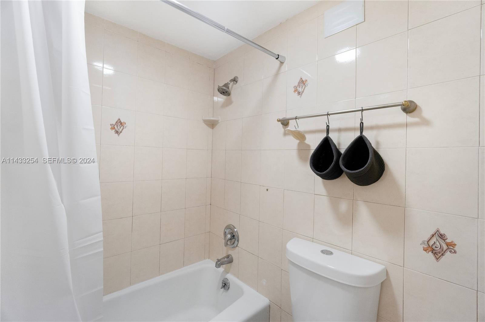 100 Lincoln Road, Unit 1039 Miami Beach, FL 33139 - Photo 19 of 26 a bathroom with a shower a toilet and a shower