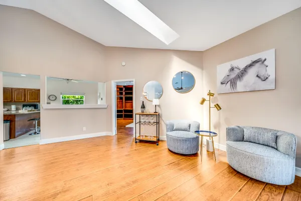 a view of a livingroom with furniture and a flat screen tv