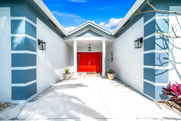 a house with red door and windows