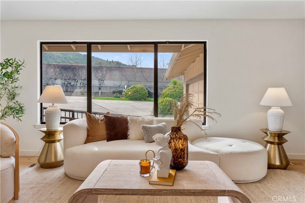931 Camino Ramon Danville, CA 94526 - Photo 23 of 67 a living room with couch a table and a large window