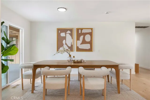 a living room with furniture and a lamp