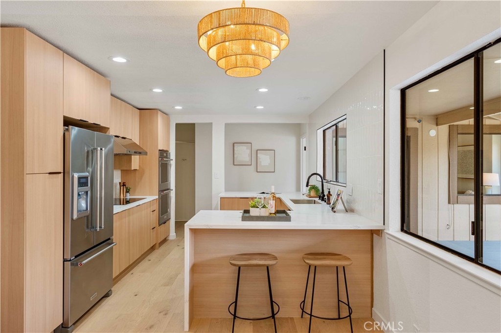 931 Camino Ramon Danville, CA 94526 - Photo 28 of 67 a kitchen with stainless steel appliances granite countertop a refrigerator and a sink