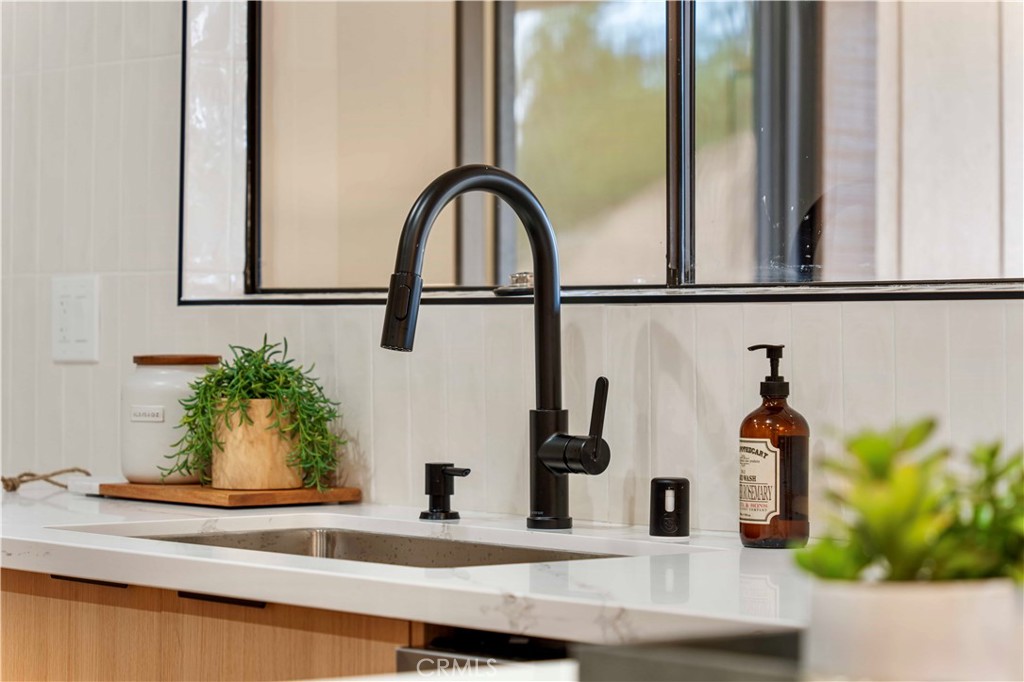 931 Camino Ramon Danville, CA 94526 - Photo 31 of 67 a bathroom with a sink and a mirror