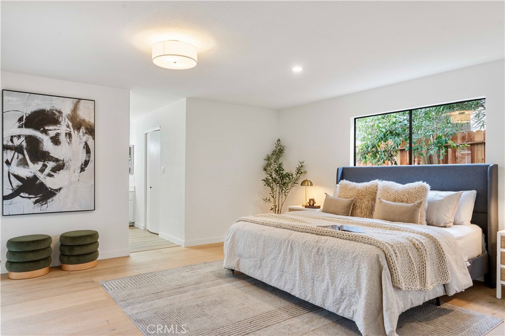 931 Camino Ramon Danville, CA 94526 - Photo 34 of 67 a bedroom with a bed and a painting on the wall