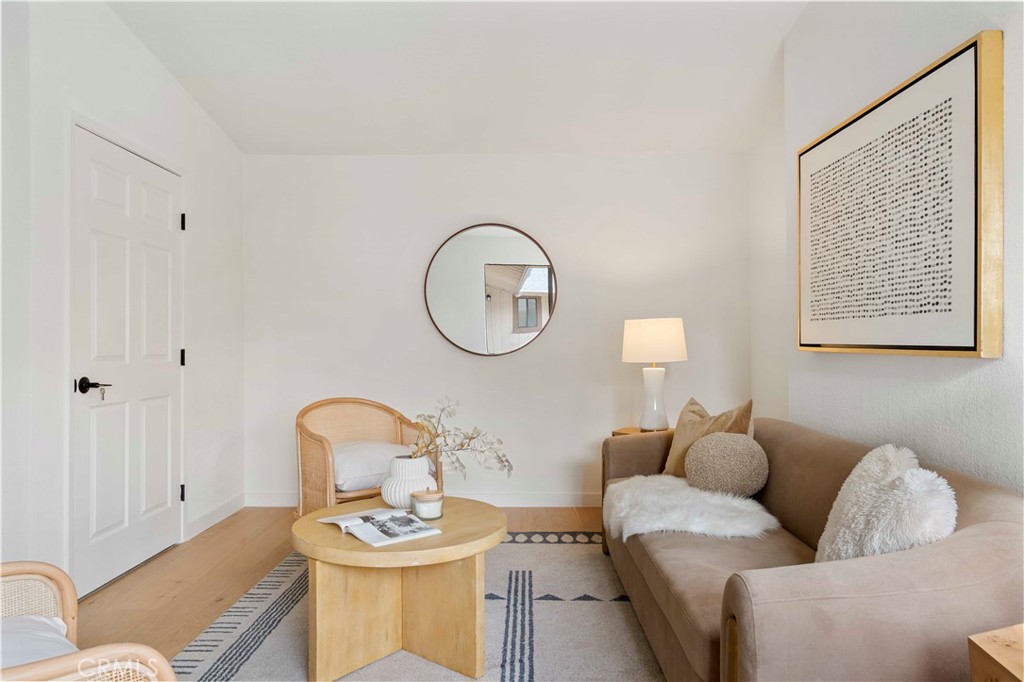 931 Camino Ramon Danville, CA 94526 - Photo 61 of 67 a living room with furniture a mirror potted plant and a window
