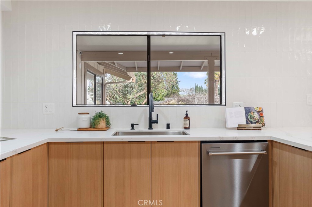 931 Camino Ramon Danville, CA 94526 - Photo 8 of 67 a bathroom with a granite countertop sink and a window