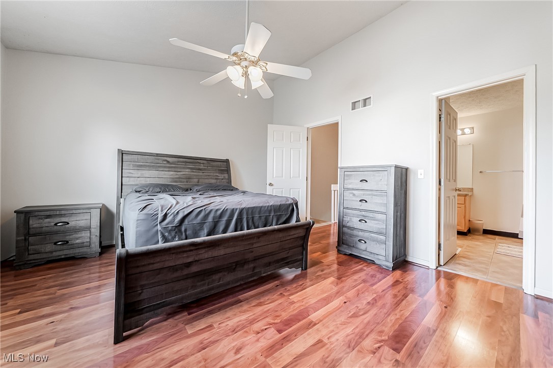 882 Overlook Ridge Drive Cleveland, OH 44109 - Photo 14 of 26 Bedroom with light wood-style flooring, high vaulted ceiling, a ceiling fan, and ensuite bathroom