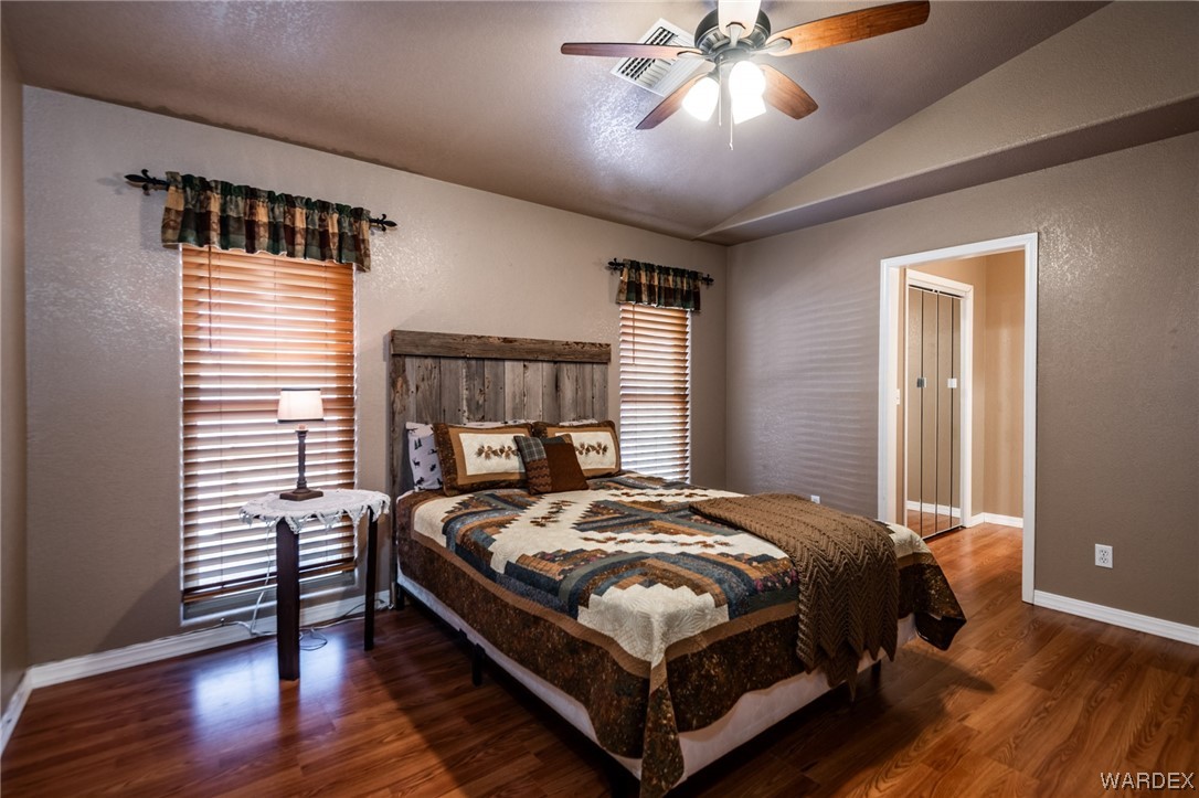 10363 East Blake Ranch Road Kingman, AZ 86401 - Photo 19 of 79 a bedroom with a bed and window
