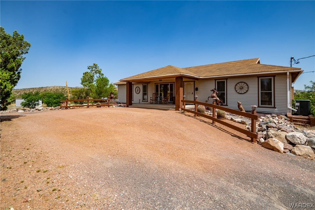 10363 East Blake Ranch Road Kingman, AZ 86401 - Photo 2 of 79 a view of a house with a yard