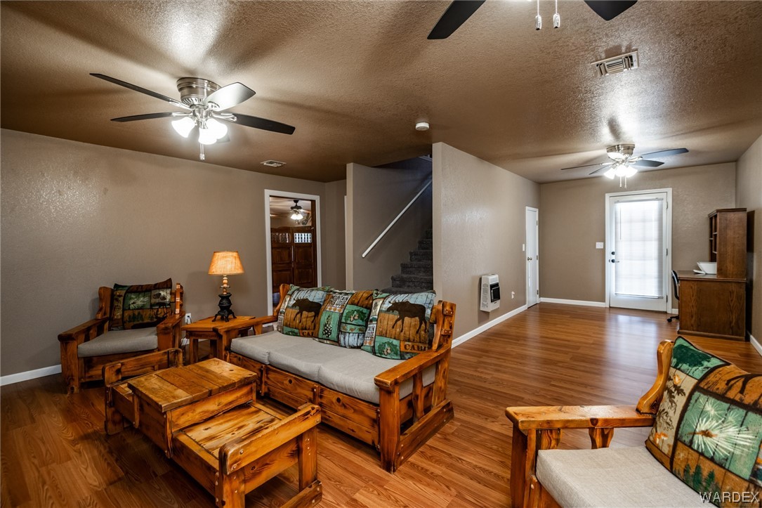 10363 East Blake Ranch Road Kingman, AZ 86401 - Photo 32 of 79 a living room with furniture and wooden floor