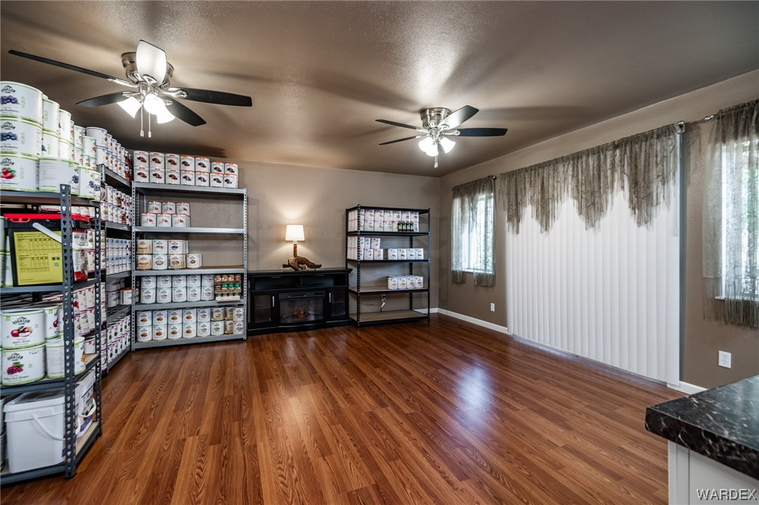 10363 East Blake Ranch Road Kingman, AZ 86401 - Photo 39 of 79 a view of a livingroom with furniture chandelier fan and windows