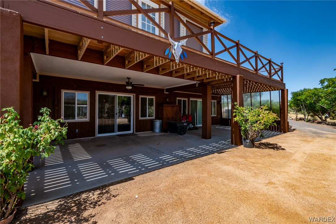 10363 East Blake Ranch Road Kingman, AZ 86401 - Photo 46 of 79 a view of a house with potted plants in front of house
