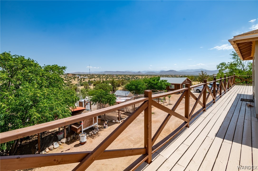 10363 East Blake Ranch Road Kingman, AZ 86401 - Photo 53 of 79 a view of balcony with wooden floor and fence